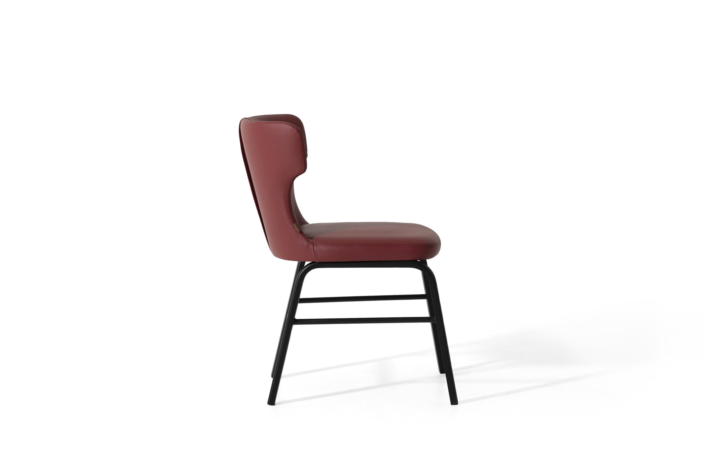Elegant red leather dining chair with modern black metal frame, perfect for contemporary home or restaurant interiors. Comfortable, stylish, and durable for everyday use.
