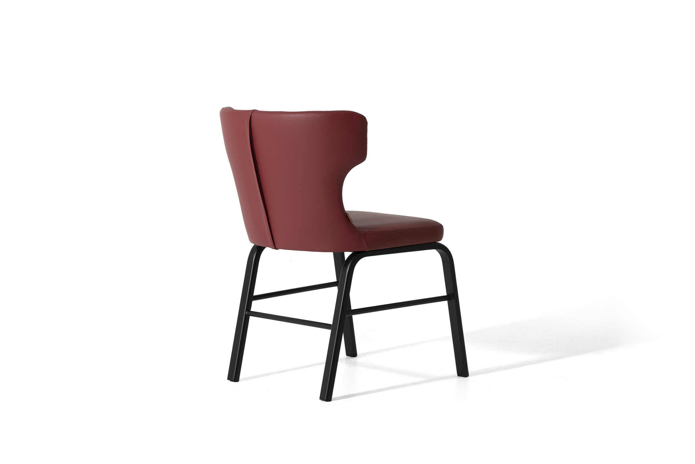 Comfortable red leather dining chair with black metal legs, modern design, perfect for contemporary kitchens and dining rooms.