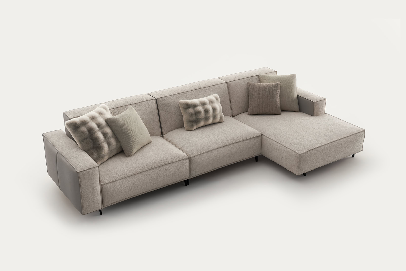 Elegant beige sectional sofa with plush cushions, perfect for contemporary living rooms, from Saloni Furniture.