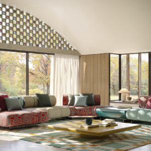 Elegant contemporary living room featuring large windows, colorful sofas, and stylish decor. Perfect for showcasing modern furniture designs and home interior inspiration.