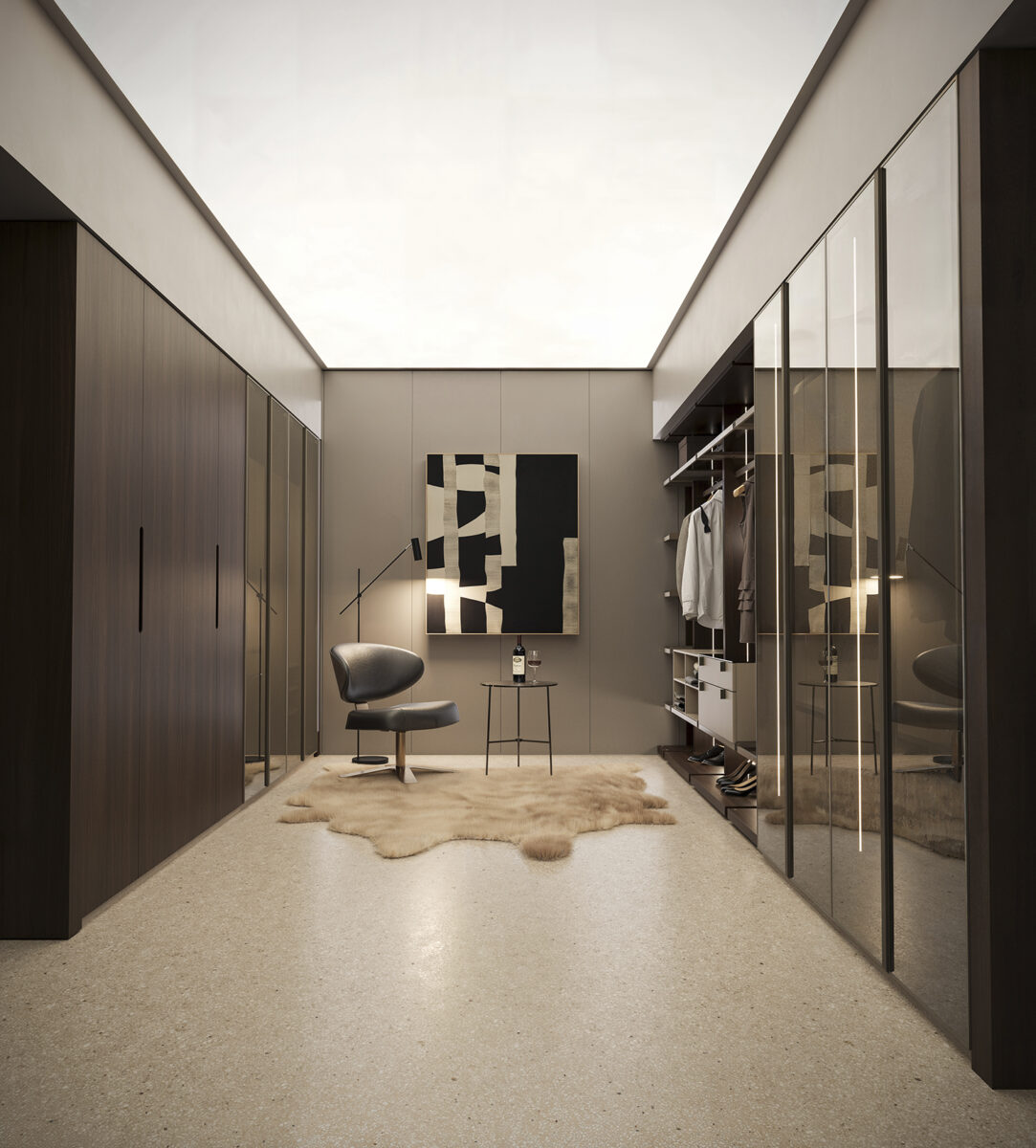 Elegant walk-in closet featuring sleek wooden cabinetry, mirrored sliding doors, and contemporary decor with a cozy rug and stylish artwork.