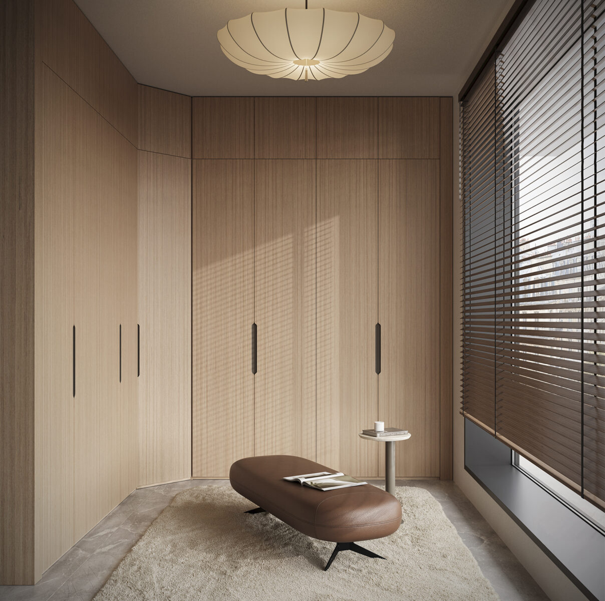 Elegant minimalist wardrobe room with wooden cabinets, a brown ottoman, and large window blinds for natural light.