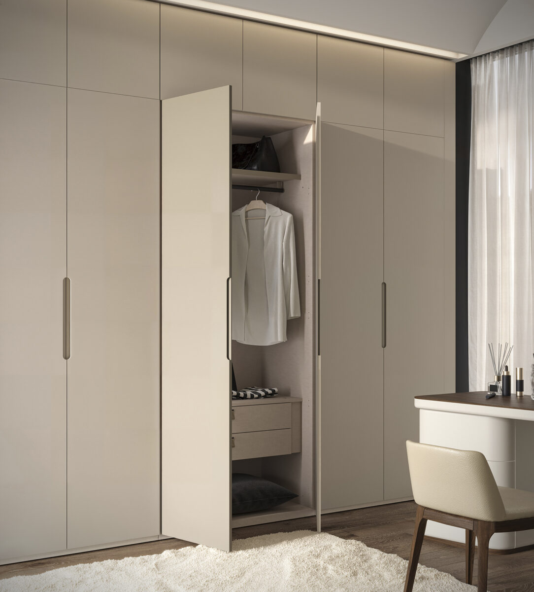 Elegant modern wardrobe with open door revealing organized interior, in a stylish bedroom setting with natural light and minimalist decor.