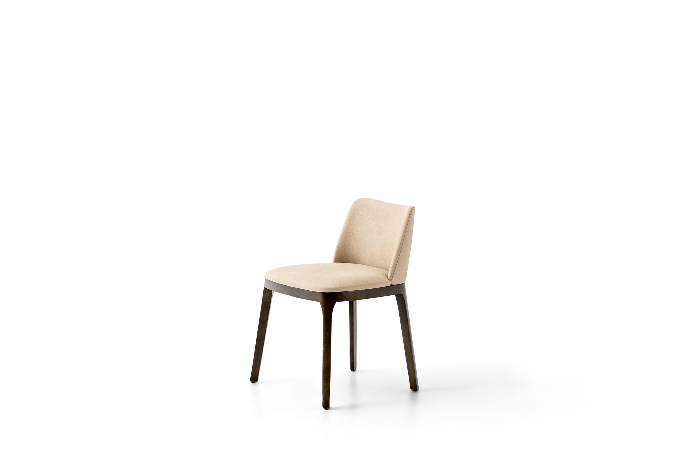 Stylish beige dining chair with wooden legs, perfect for modern home interiors, from Saloni Furniture.
