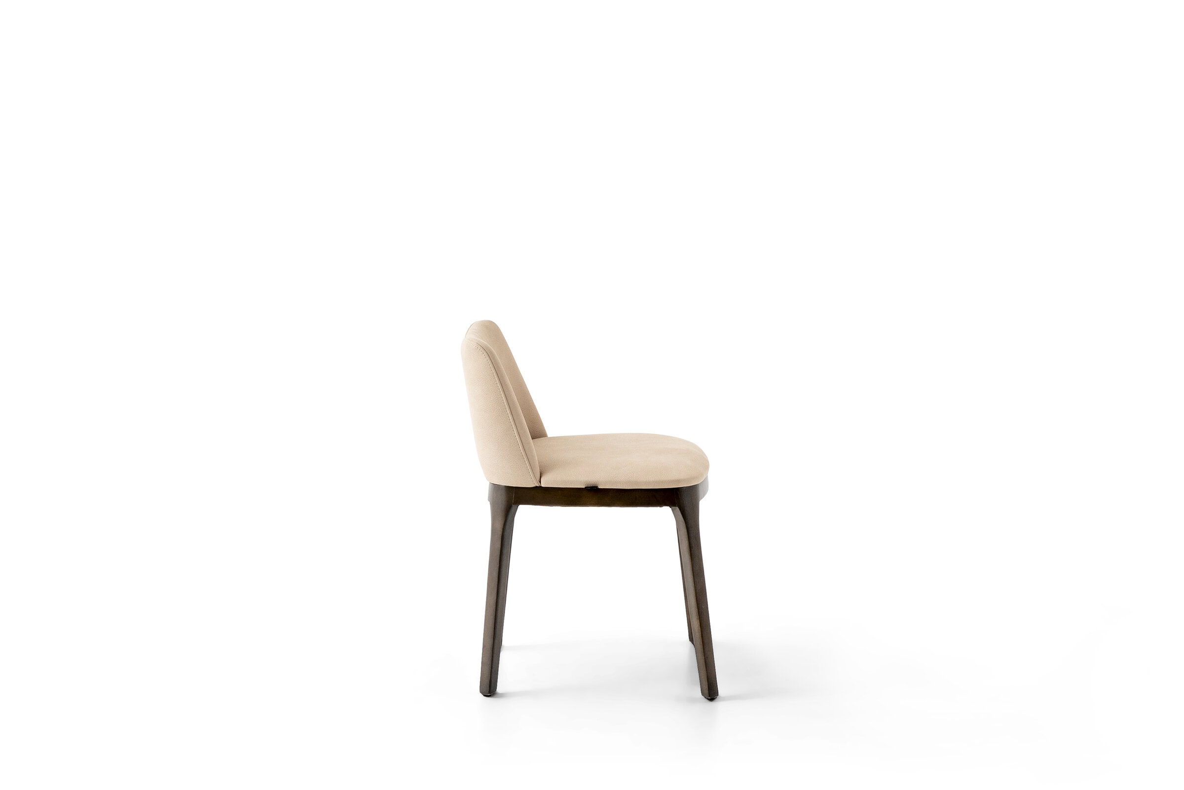 Stylish beige dining chair with wooden legs from Saloni Furniture, perfect for modern dining rooms and interior decor.
