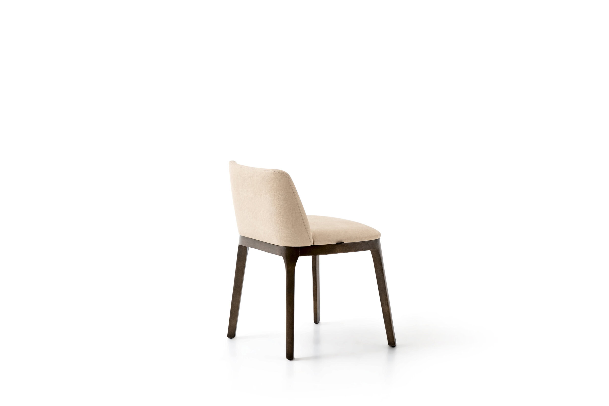 Modern beige upholstered dining chair with dark wooden legs, ideal for contemporary home interiors.