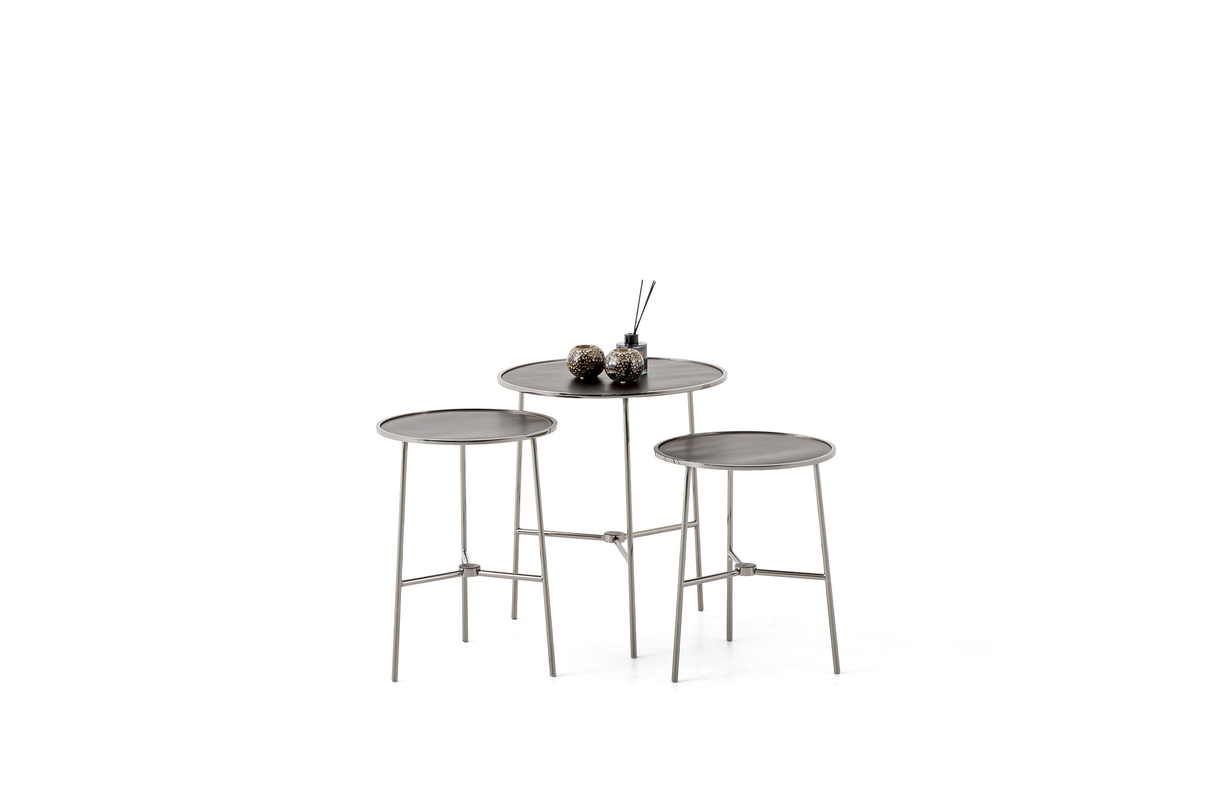 Contemporary metal bistro table with three matching stools, minimalist design, ideal for cafes or home dining spaces.