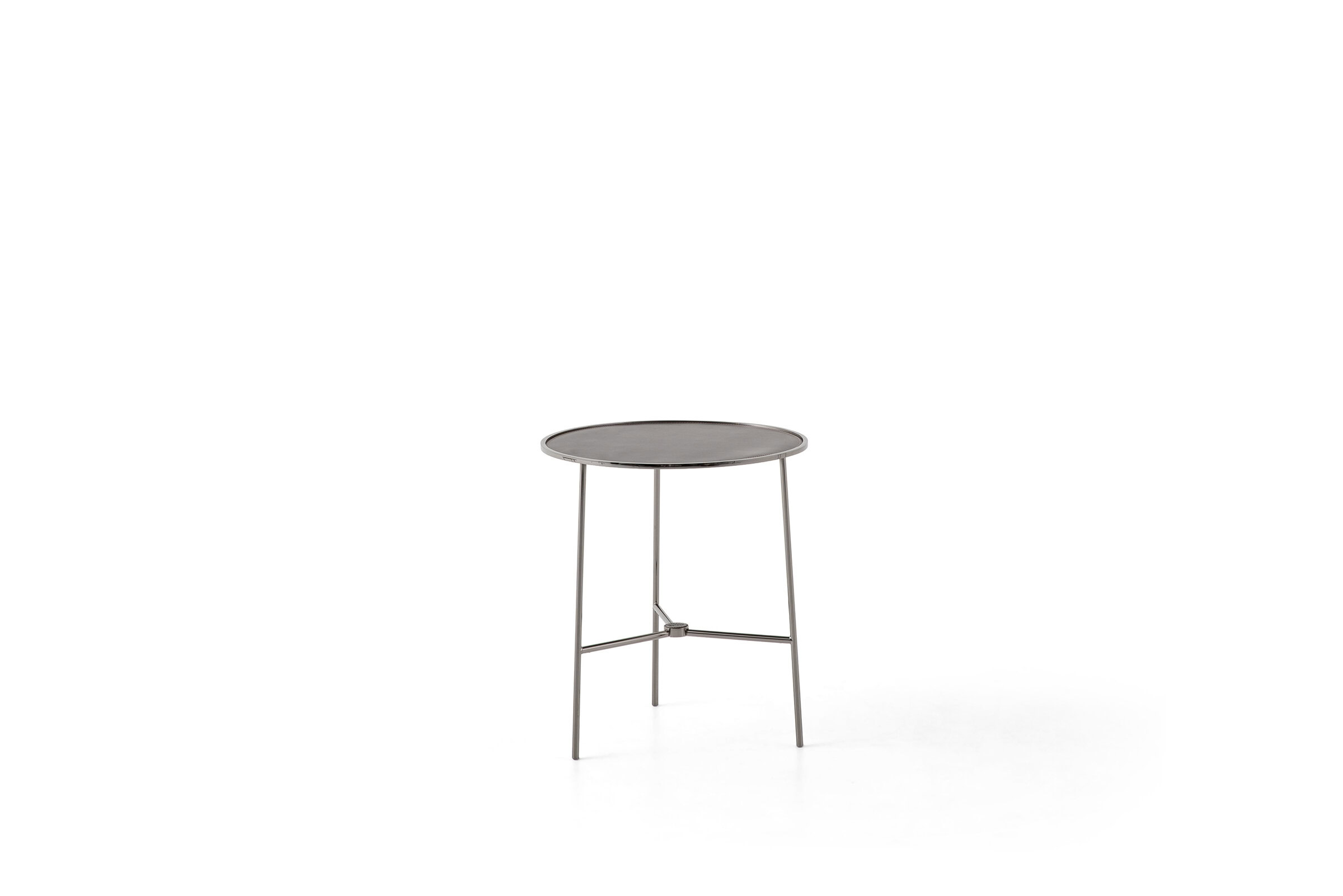 Elegant modern side table with a round top and sleek metal legs, ideal for contemporary living spaces.