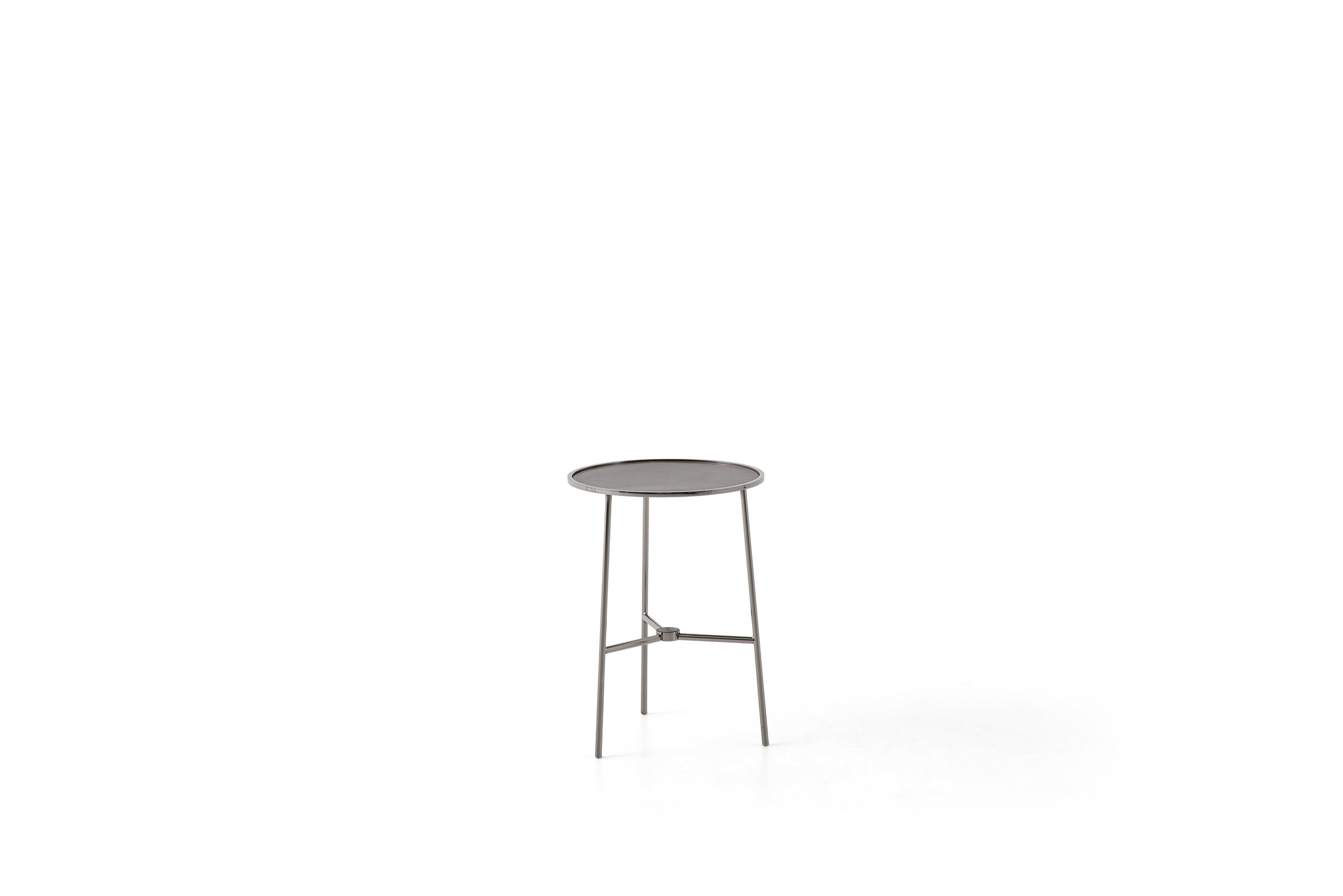 Elegant modern side table with a round top and sleek metal legs, ideal for contemporary living spaces.