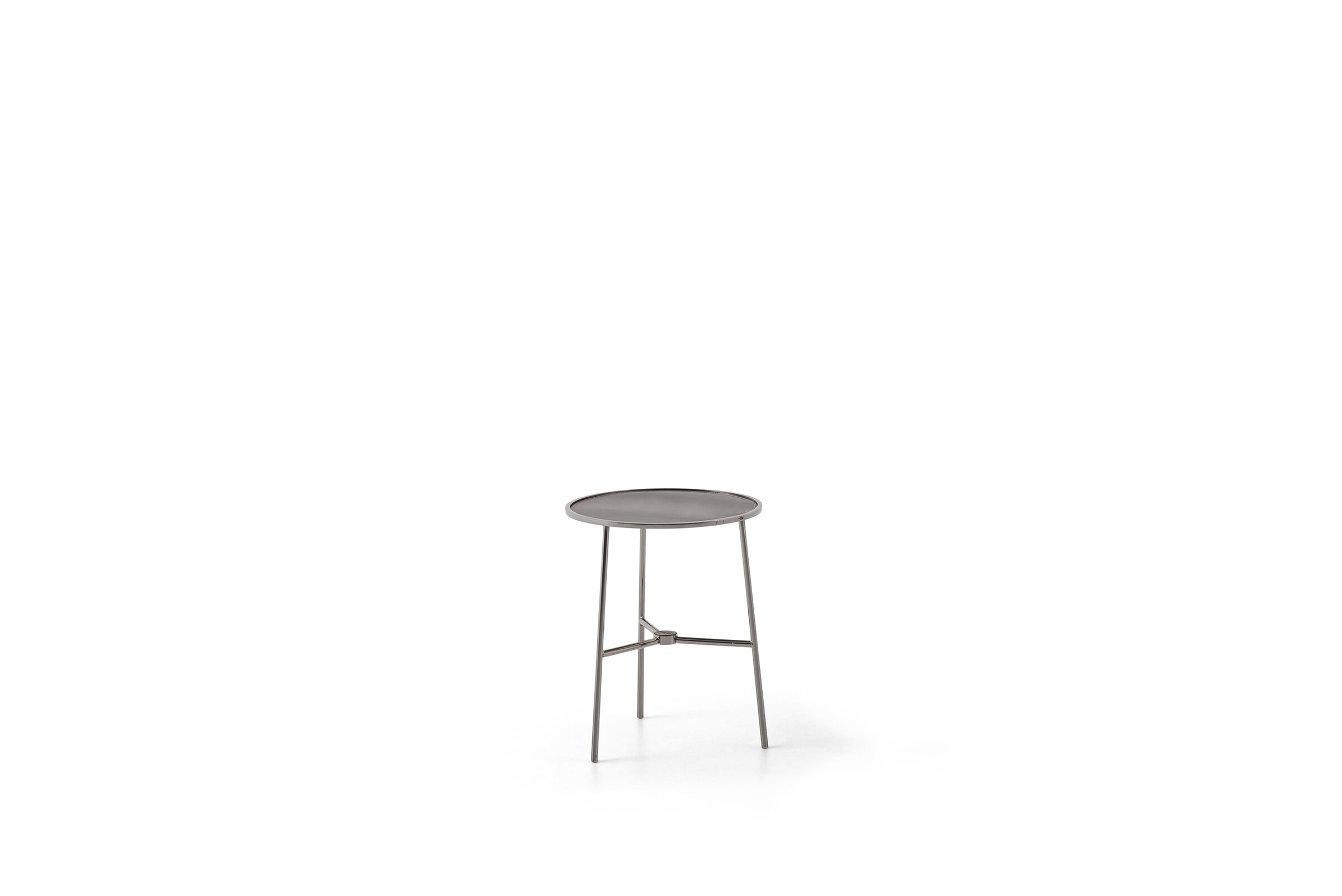 Elegant modern side table with a round top and sleek metal legs, perfect for contemporary home decor from Saloni Furniture.