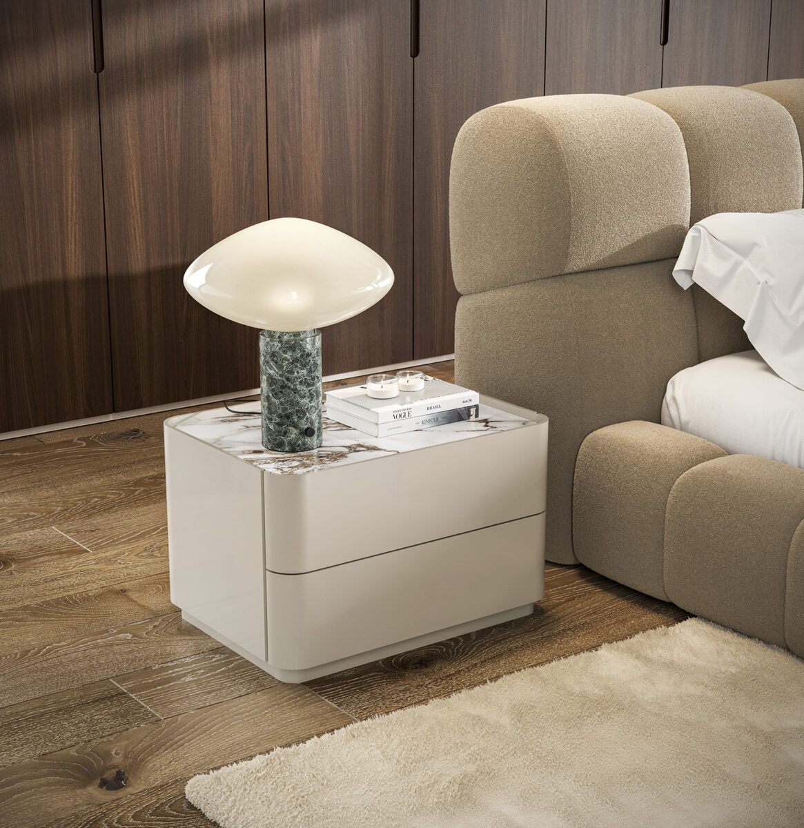 Elegant white bedroom nightstand with a stylish mushroom-shaped lamp and books, set beside a beige upholstered bed in a contemporary bedroom.