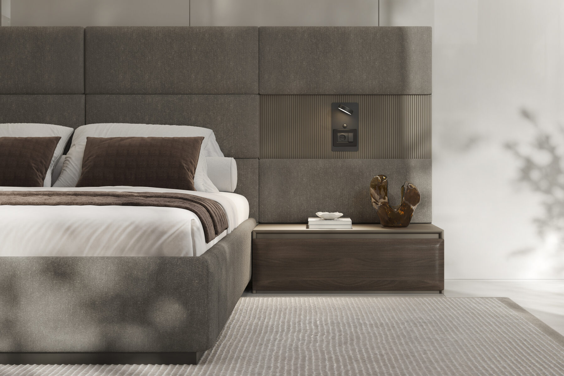 Elegant bedroom furniture featuring a plush upholstered bed and a sleek wooden nightstand, perfect for contemporary interior design.