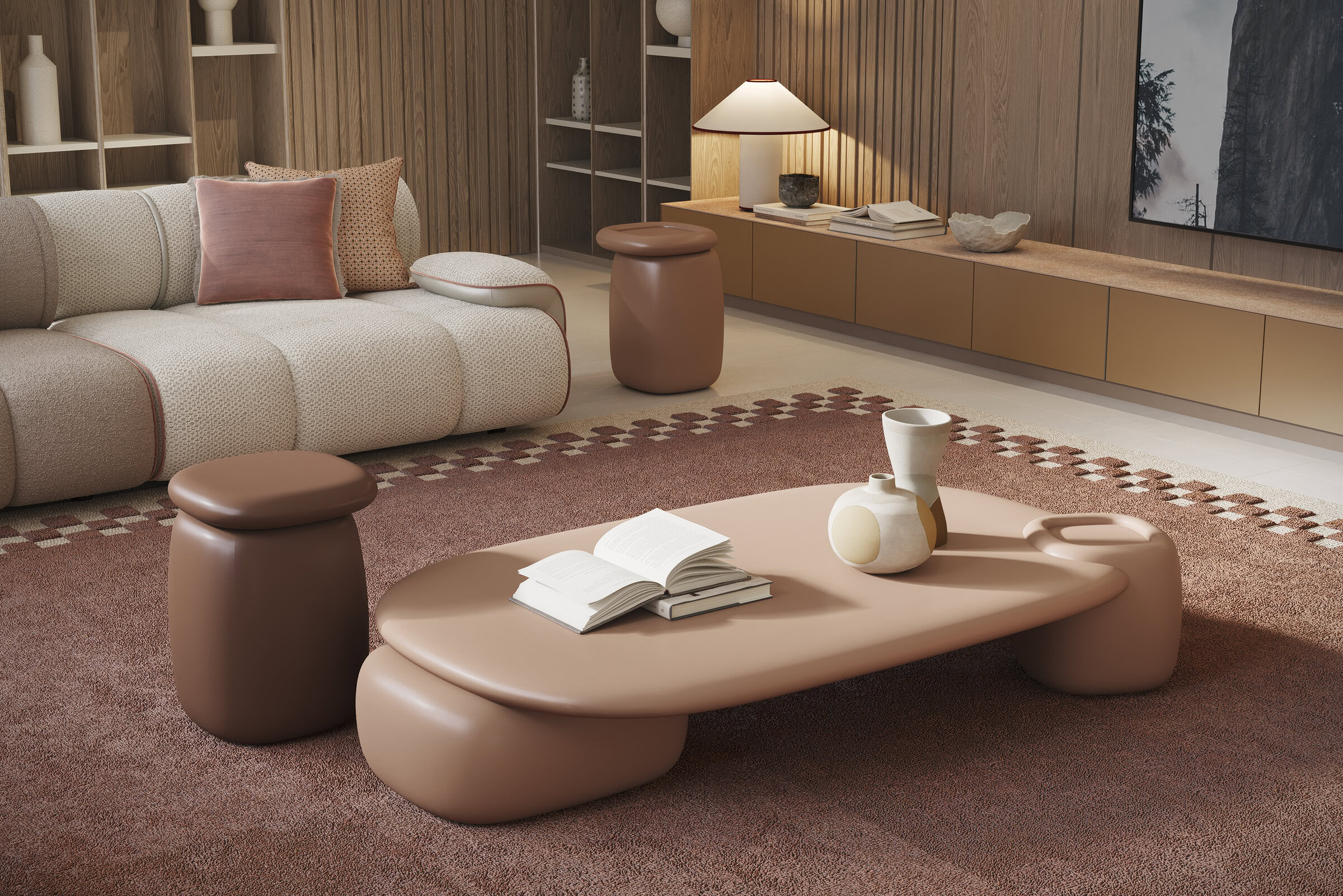 Contemporary living room with beige sofa, pink cushions, and a unique pink coffee table with decorative vases and books.