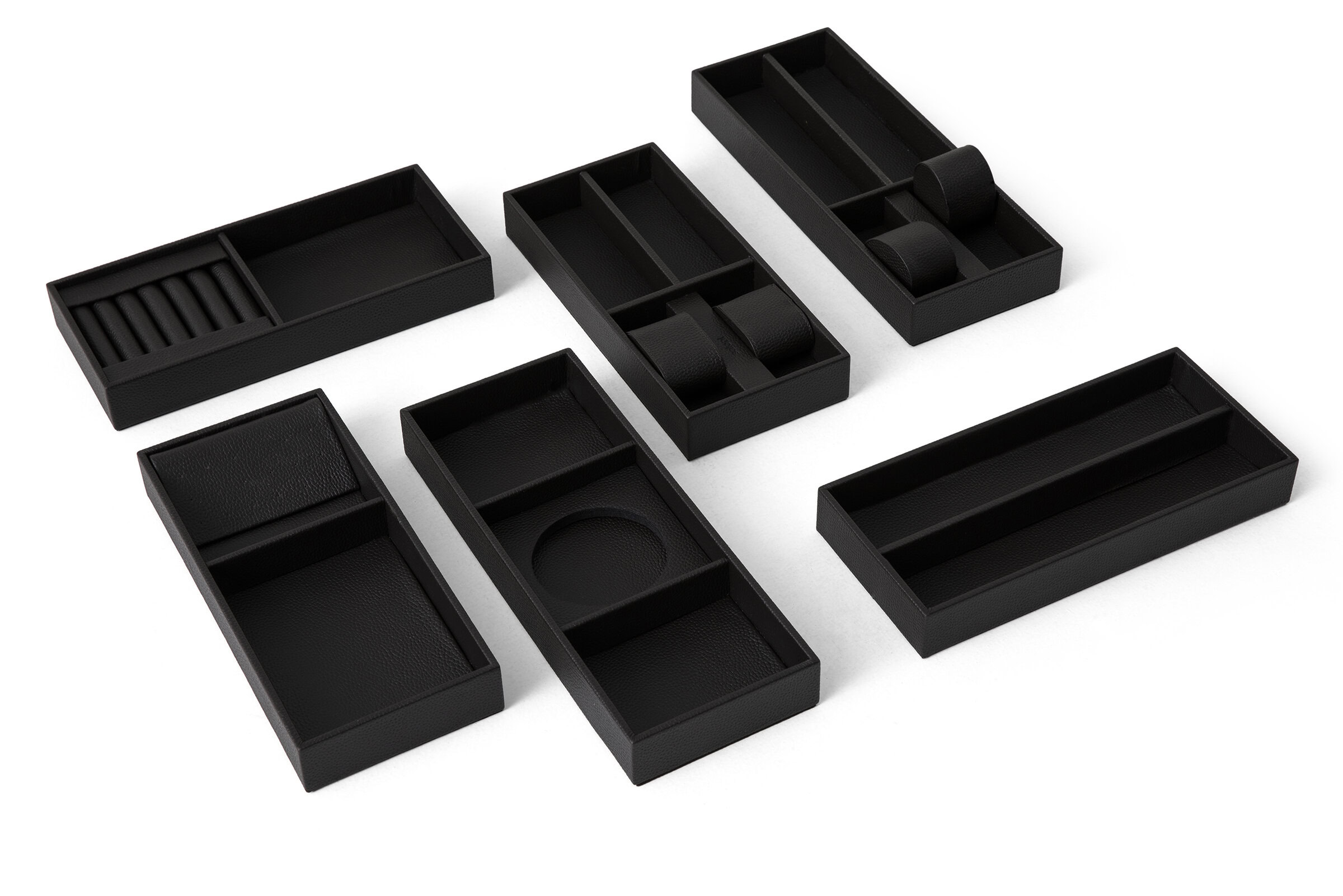 Stylish black desk organizer with various compartments for pens, paper clips, and accessories, ideal for maintaining a tidy workspace and enhancing office organization.