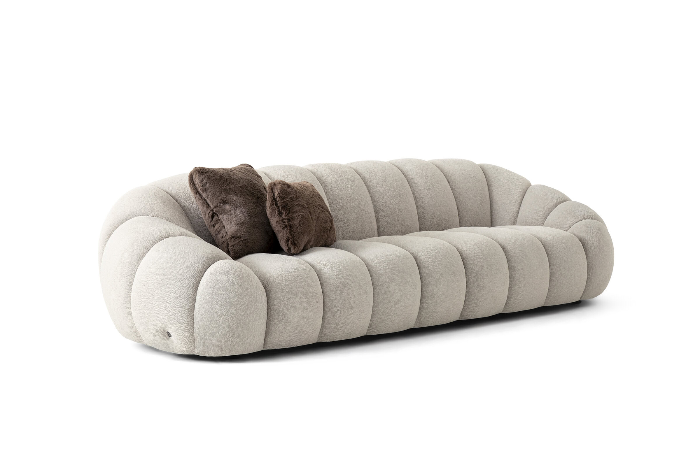 Elegant beige plush sofa with rounded design and two brown cushions, ideal for contemporary living room decor.