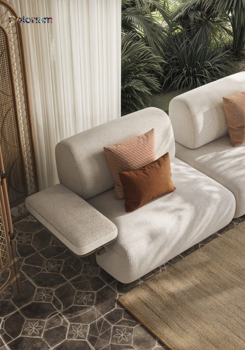 Elegant white sofa set with orange and brown cushions in a stylish living room with lush green plants and patterned tile flooring.