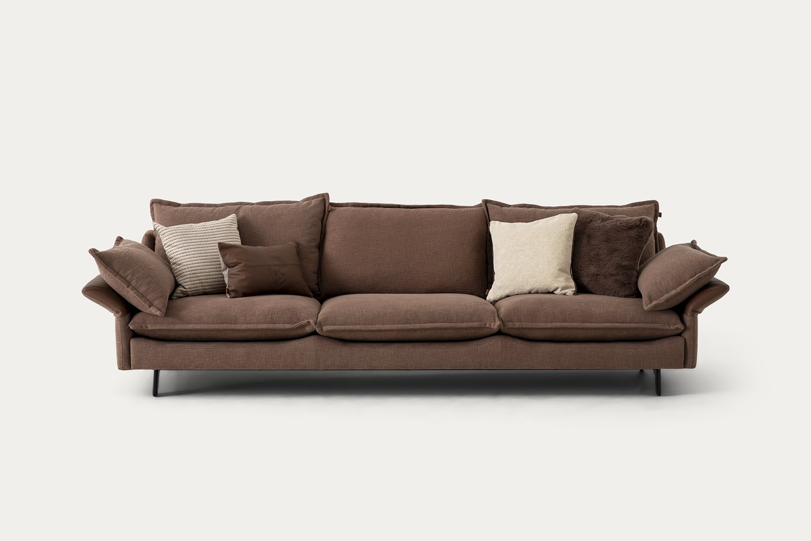 Stylish brown sofa with multiple cushions from Saloni Furniture, perfect for modern living rooms.