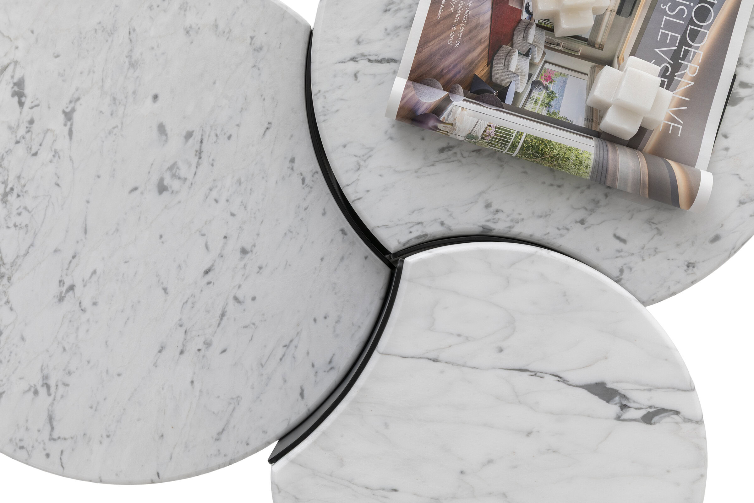 Elegant marble coffee tables by Saloni Furniture featuring sleek white and gray veined surfaces, perfect for modern living room decor.