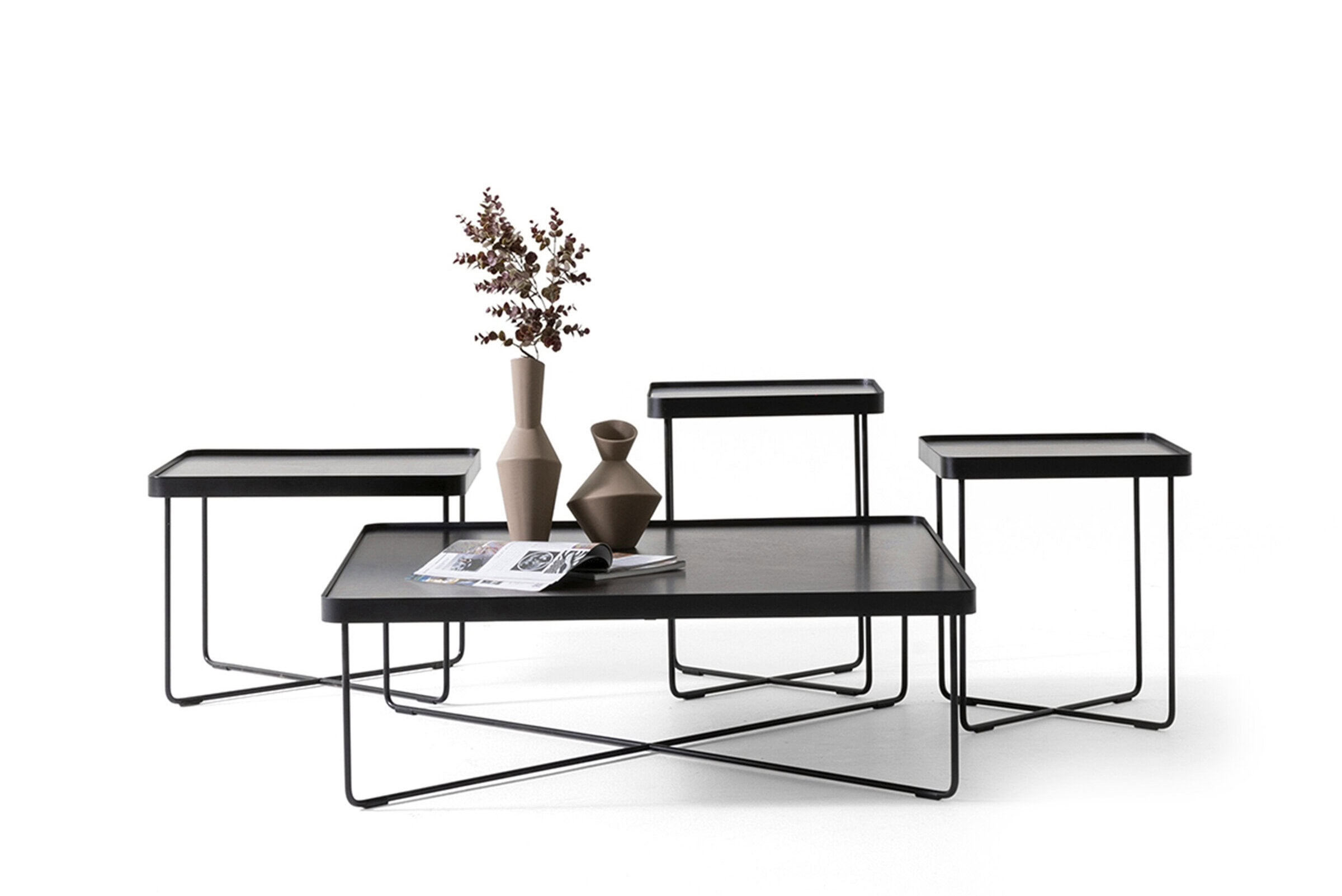 Contemporary black metal coffee and side tables set with minimalist design, perfect for modern living rooms or office spaces, highlighting sleek furniture from Saloni Furniture.