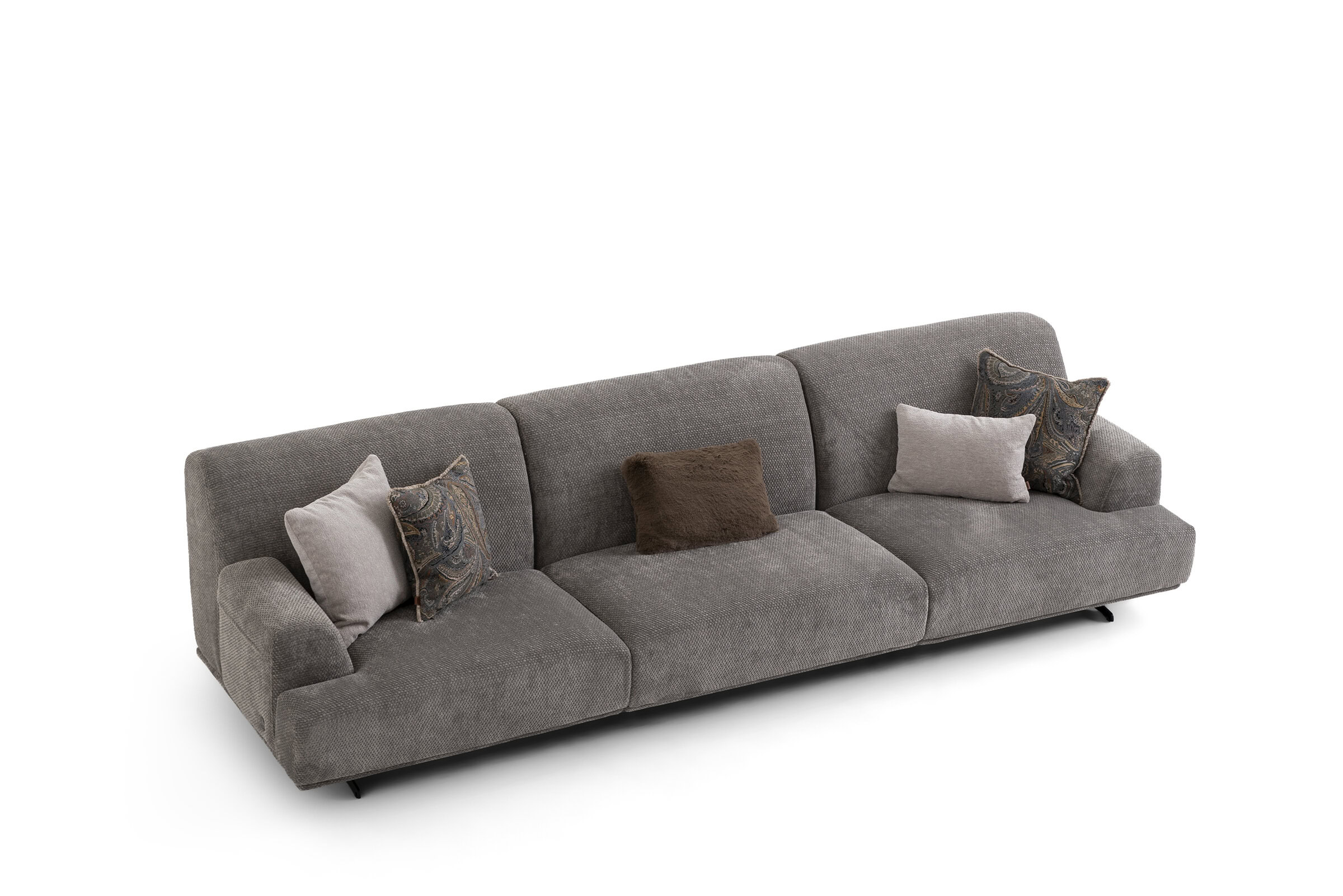Grey fabric sofa with multiple decorative cushions, perfect for contemporary living rooms. Comfortable, stylish, and durable furniture piece from Saloni Furniture.
