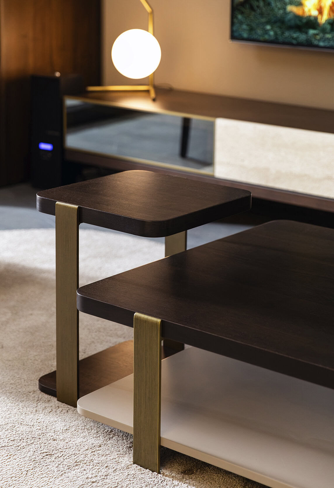 Stylish modern wooden coffee table with metal accents in contemporary living room setting.