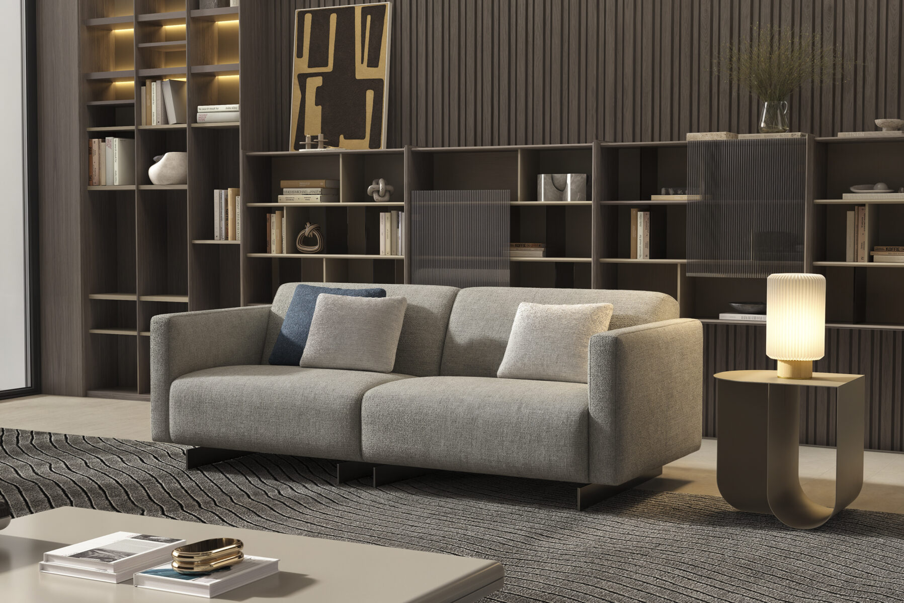 Contemporary living room with modern gray sofa, wooden bookshelf, and stylish side table with lamp, showcasing elegant home furniture for living room decor.