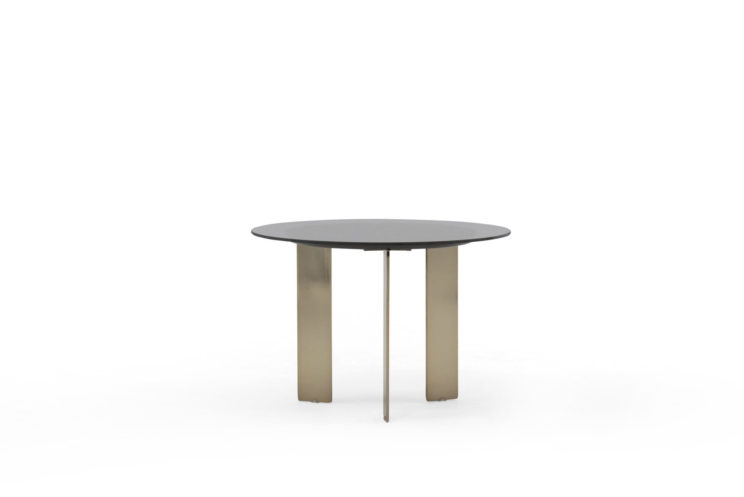 Sleek modern round dining table with a black top and metallic gold legs, perfect for contemporary home interiors and stylish dining spaces.