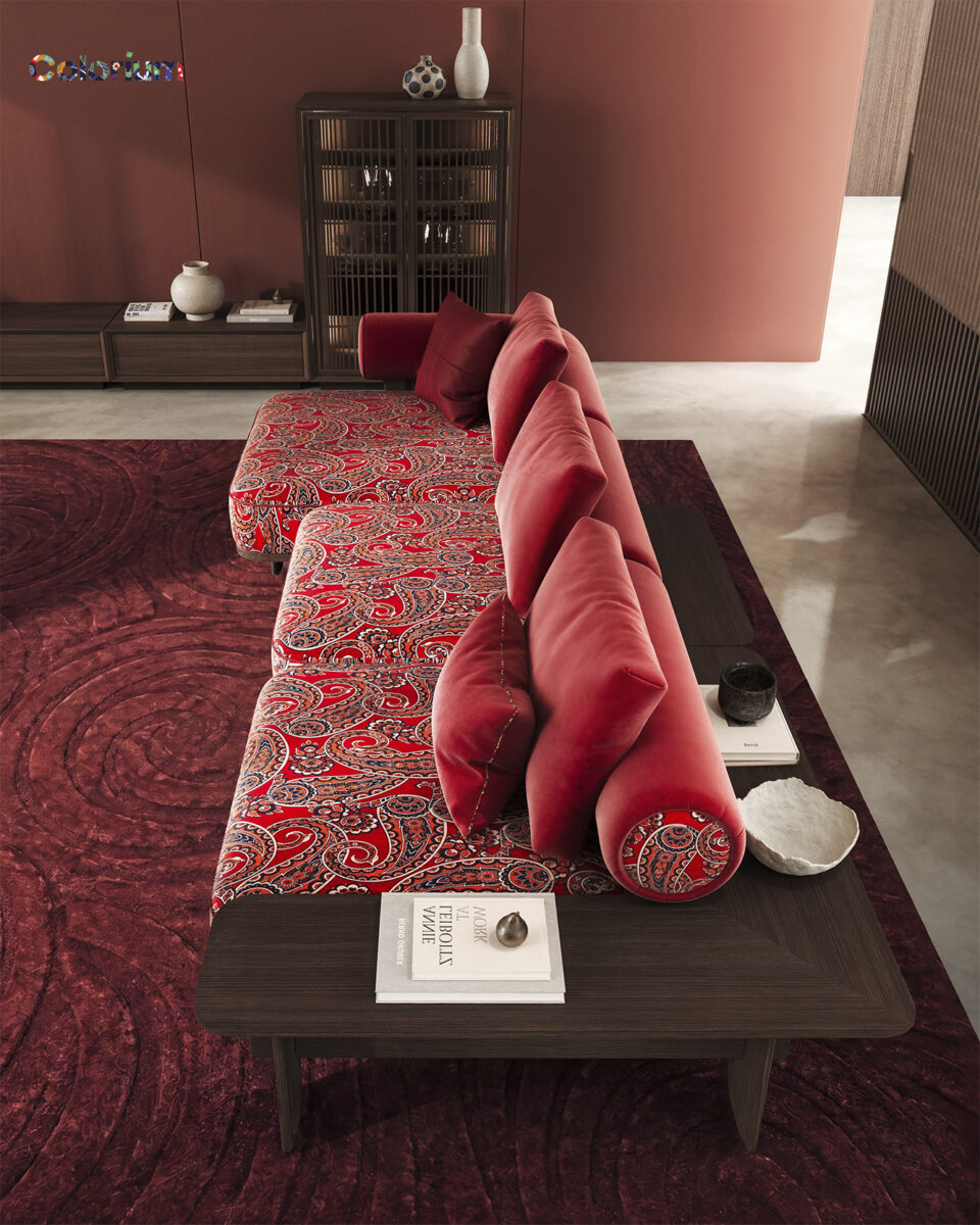 Elegant modern sofa set with plush red cushions and intricate patterned upholstery, perfect for contemporary living rooms.
