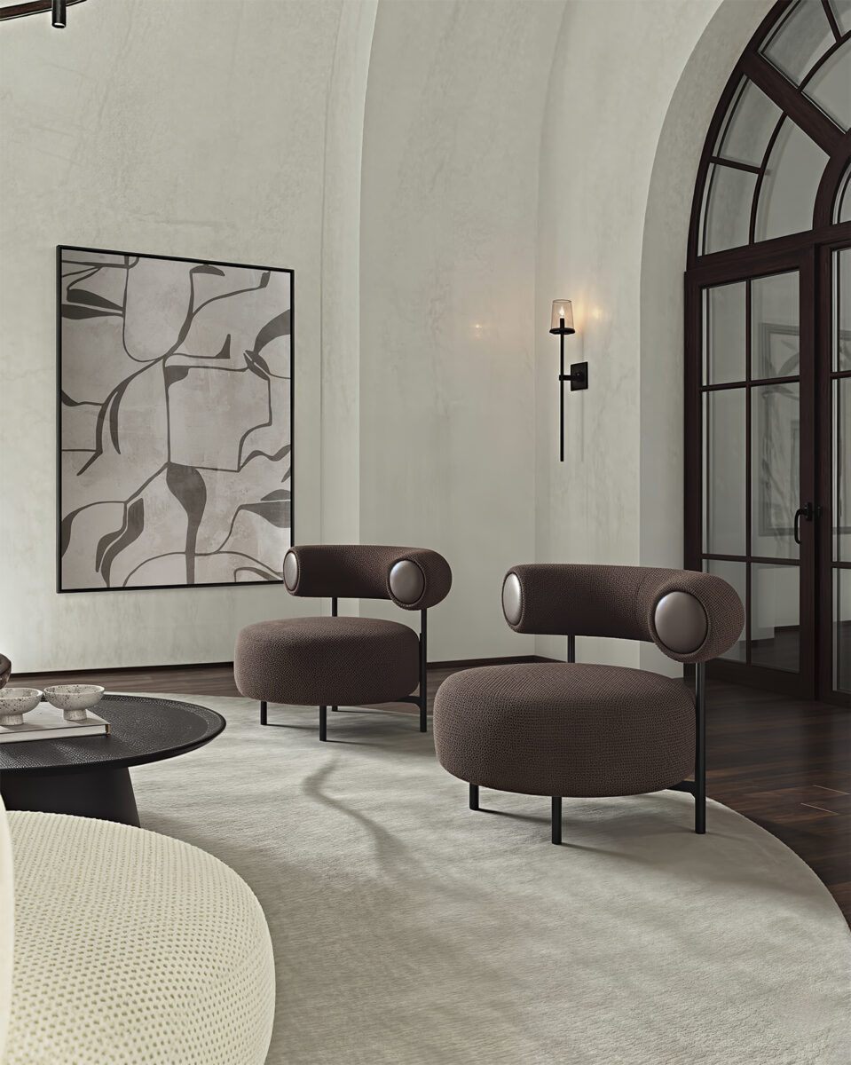Elegant modern lounge chairs with rounded backrests and plush upholstery, perfect for stylish living rooms or waiting areas.