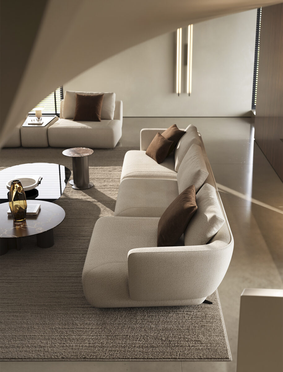 Elegant modern living room with beige sofas, brown cushions, and minimalist decor from Saloni Furniture.