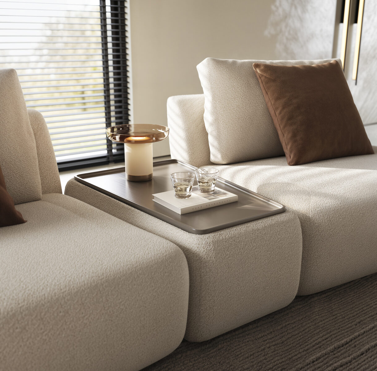 Elegant modern living room sofa set with beige upholstery, brown cushions, and a sleek coffee table with decorative items, perfect for contemporary home decor.