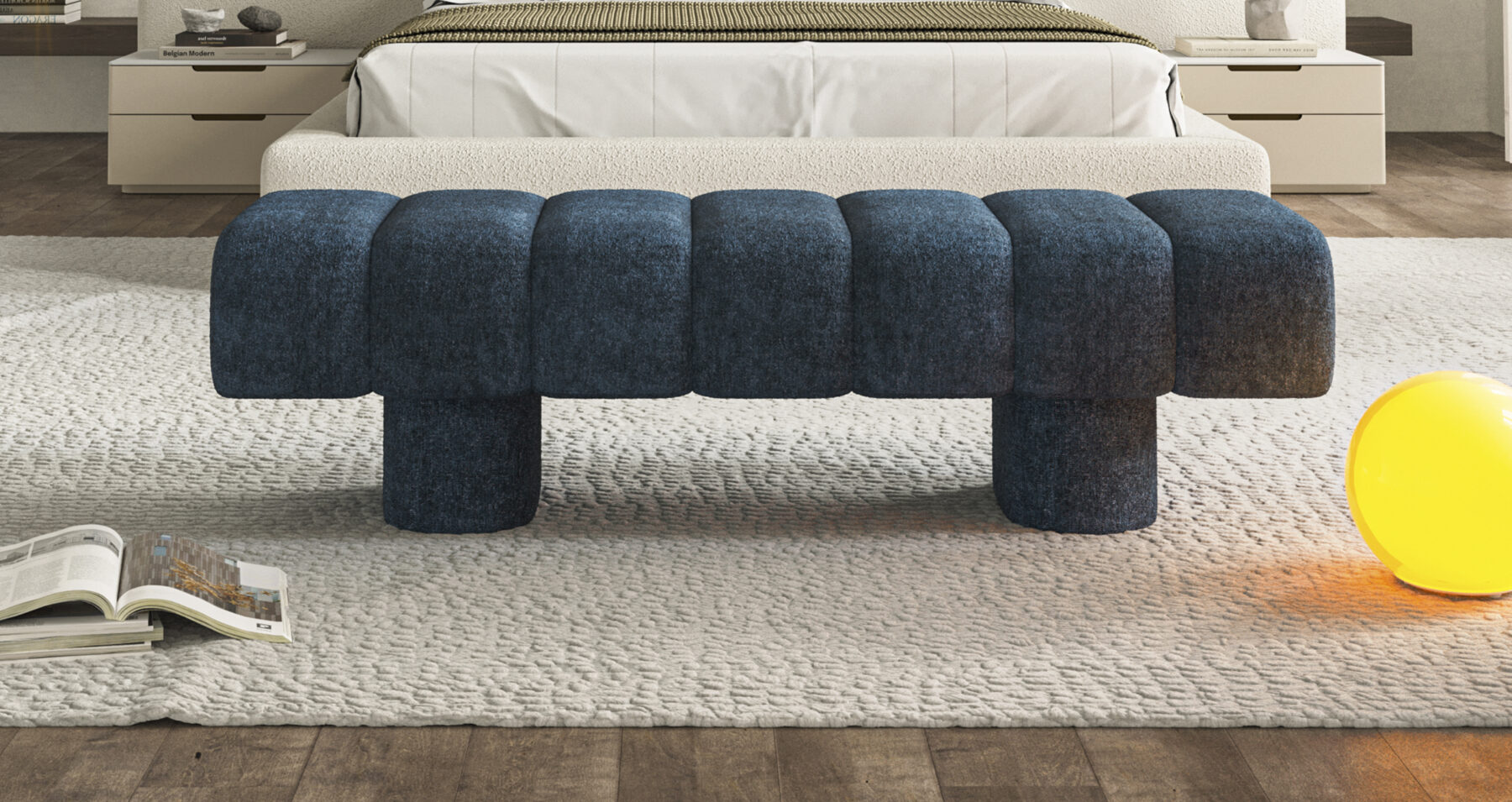 Contemporary blue upholstered ottoman with rounded, chunky design, perfect for modern living room decor.