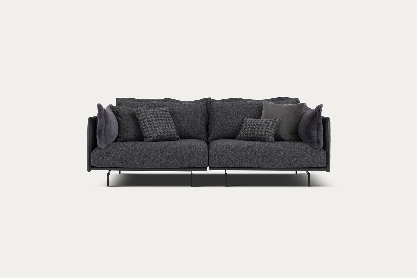 Elegant dark gray sofa with matching cushions, perfect for contemporary living rooms, from Saloni Furniture.
