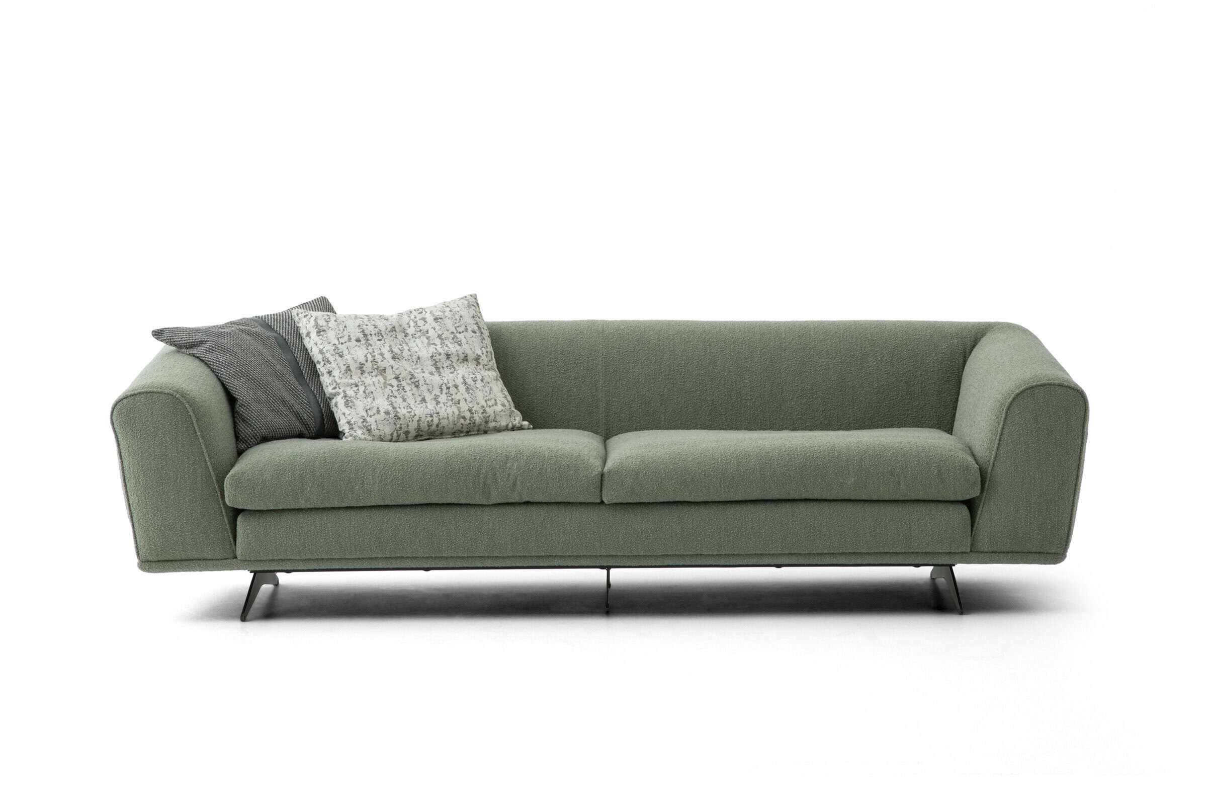 Green fabric sofa with sleek design and comfortable cushions, ideal for contemporary living spaces. Perfect for adding style and functionality to your home.
