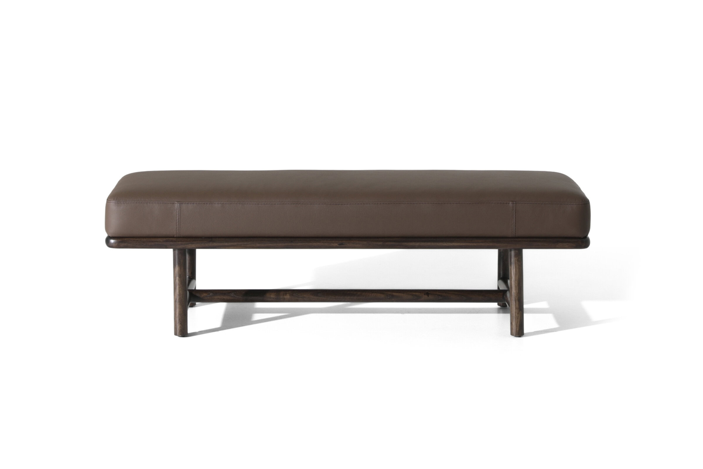 Elegant brown leather bench with wooden frame, ideal for entryways, living rooms, or bedrooms, combining comfort and style in modern home decor.