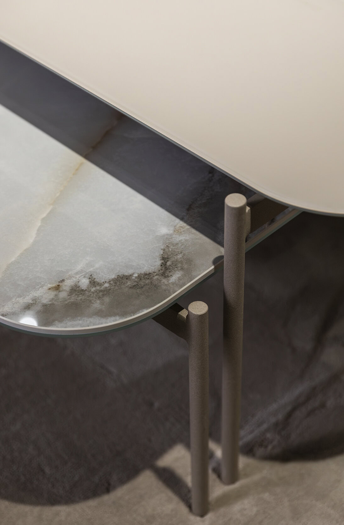 Close-up of a contemporary Saloni Furniture table with a sleek, minimalist design and metal legs, showcasing quality craftsmanship and modern aesthetics.
