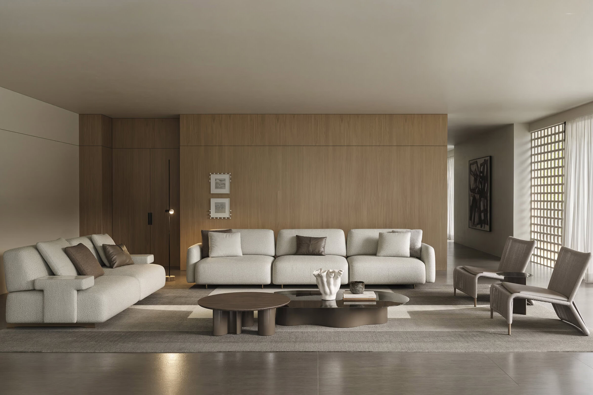 Elegant modern living room with white sofas, wooden coffee table, and armchairs, featuring minimalist decor and natural lighting.