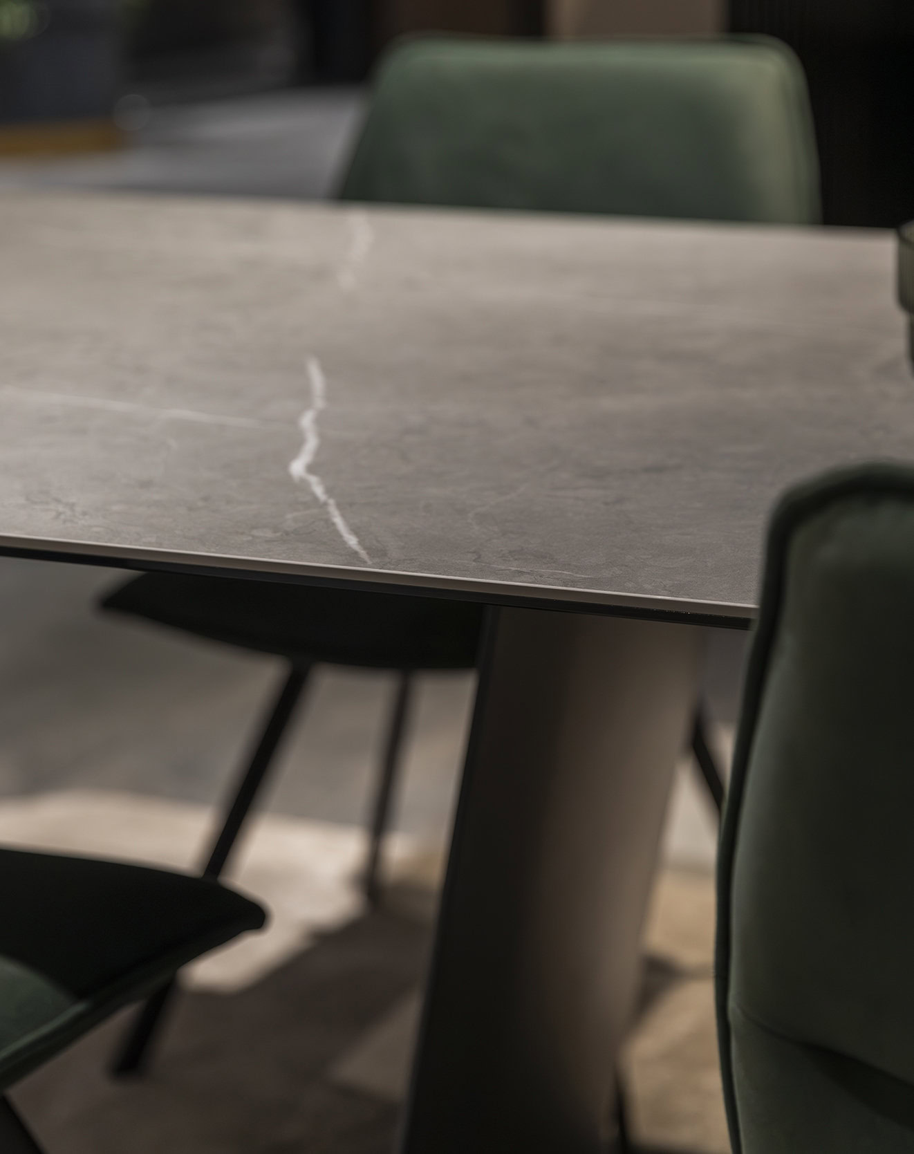 Modern marble top dining table with sleek pedestal base, perfect for contemporary home decor and stylish gatherings.