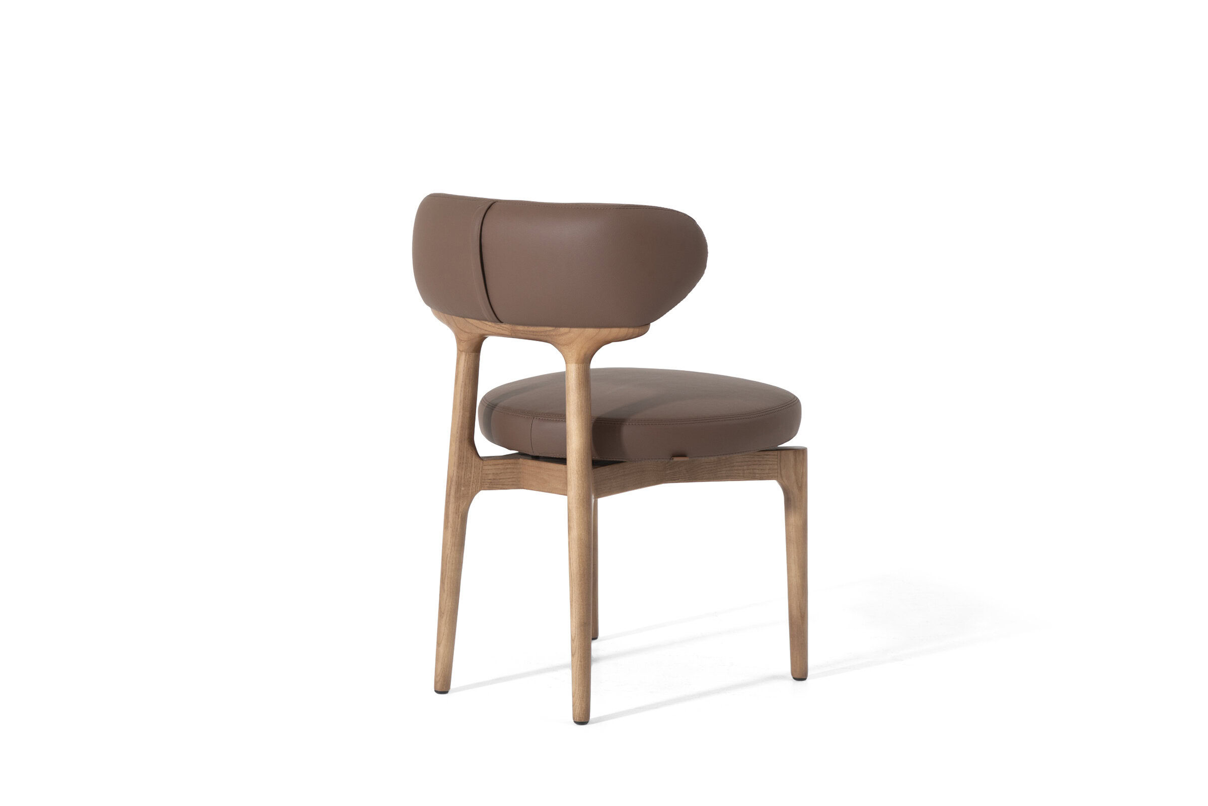 Sleek modern dining chair with leather upholstery and natural wood frame, perfect for contemporary interior design and comfortable seating.