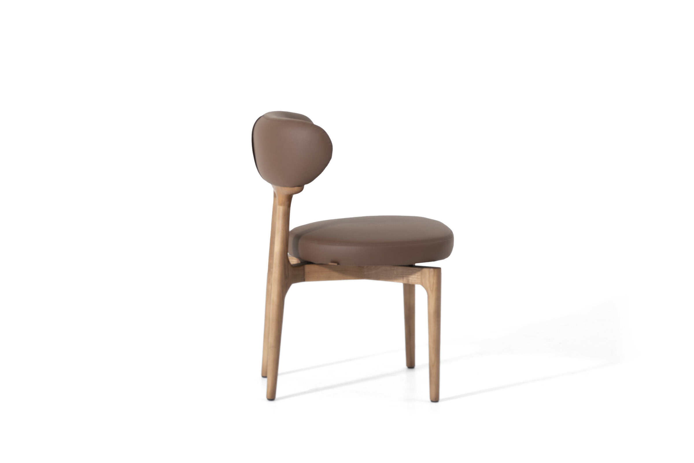 Elegant wooden chair with cushioned seat and backrest, perfect for contemporary home or office decor, showcasing stylish design and comfortable seating.