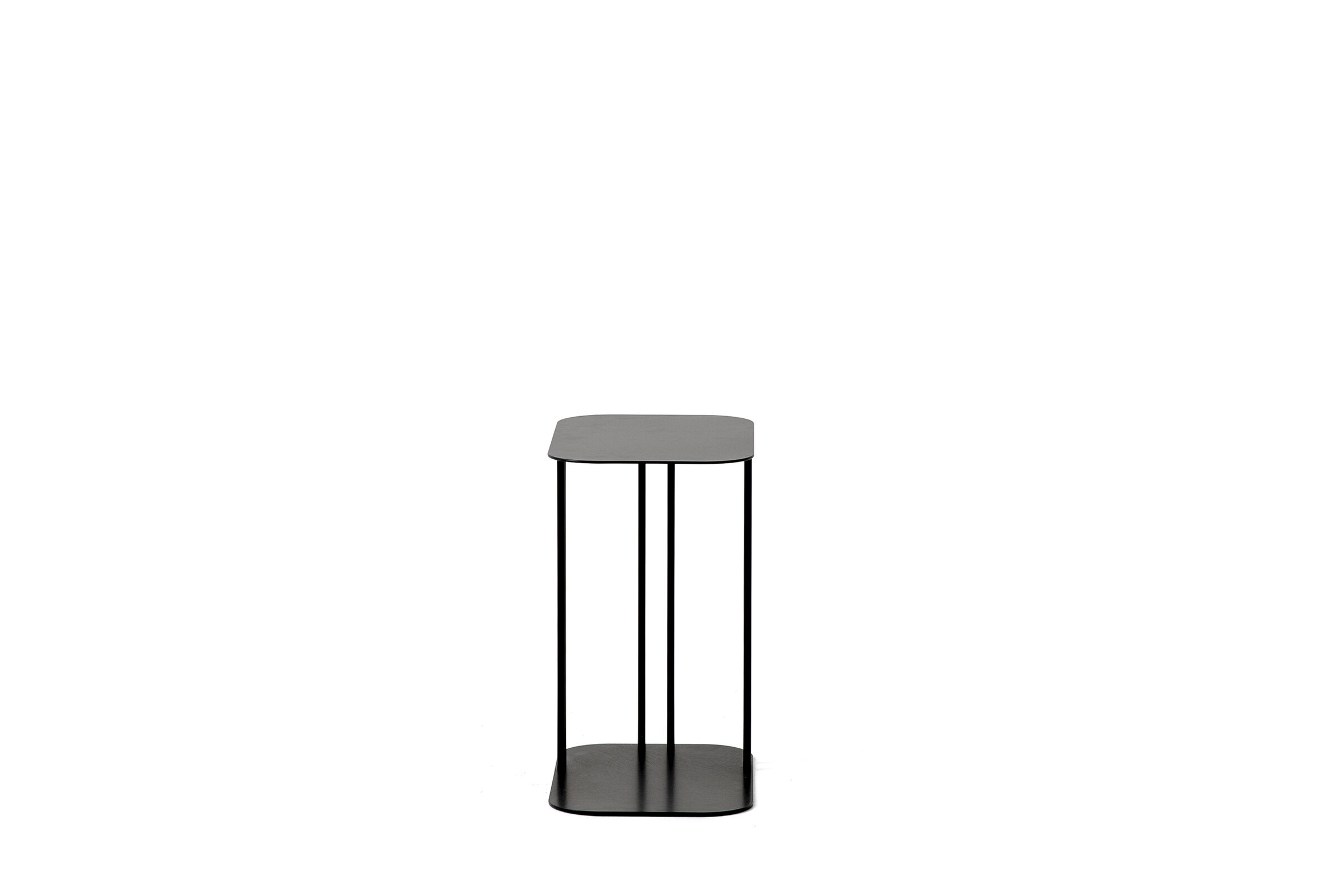 Contemporary black metal side table with a minimalist design, featuring a round top and open frame, ideal for living room or bedroom decor.