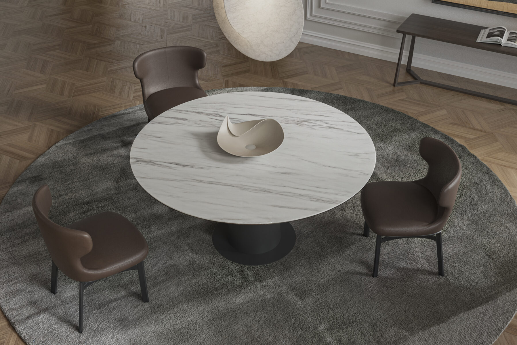 Modern round marble dining table with three brown leather chairs in a stylish interior setting.