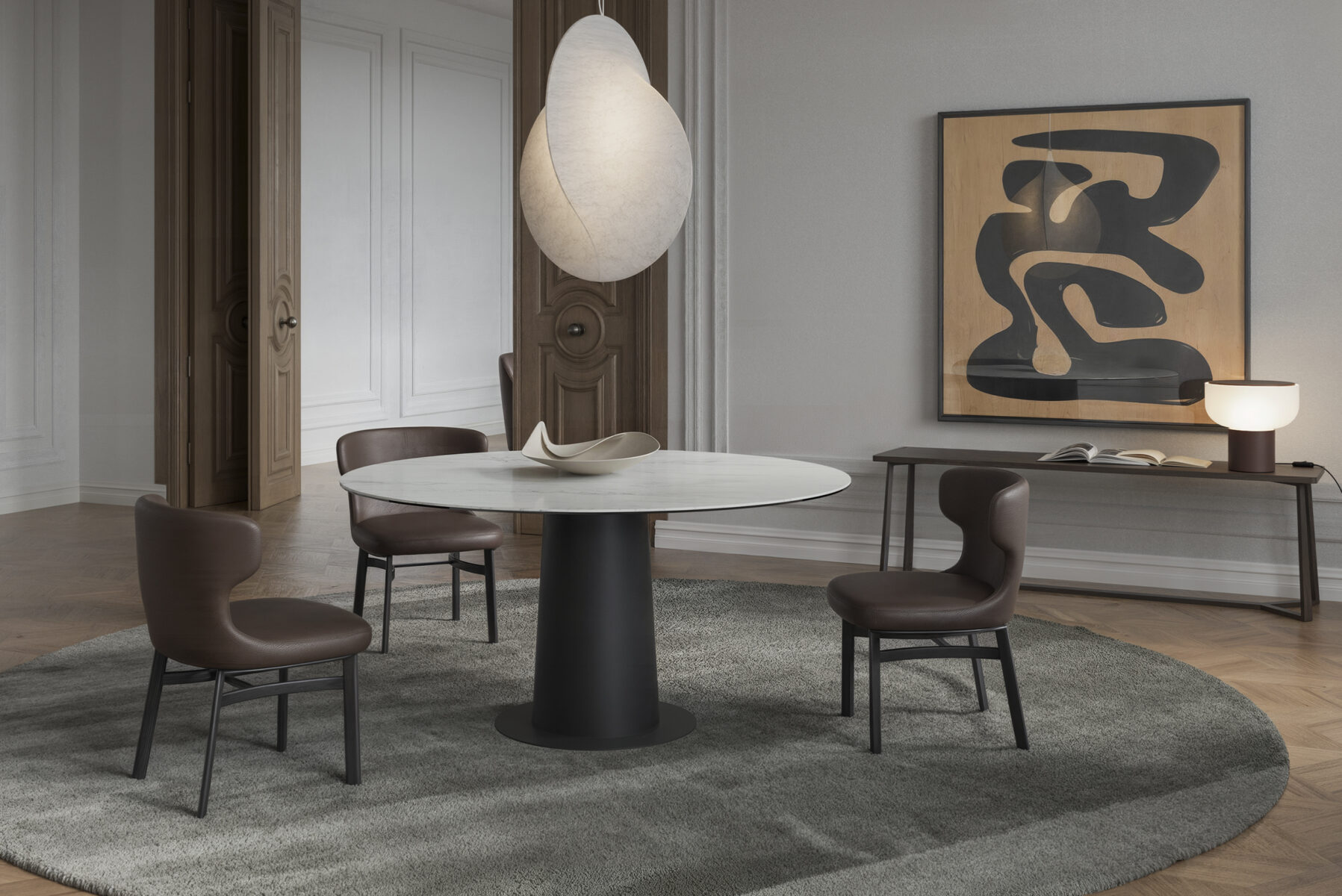 Elegant dining room with Saloni Furniture round table, four brown chairs, contemporary artwork, and stylish lighting in a sophisticated setting.