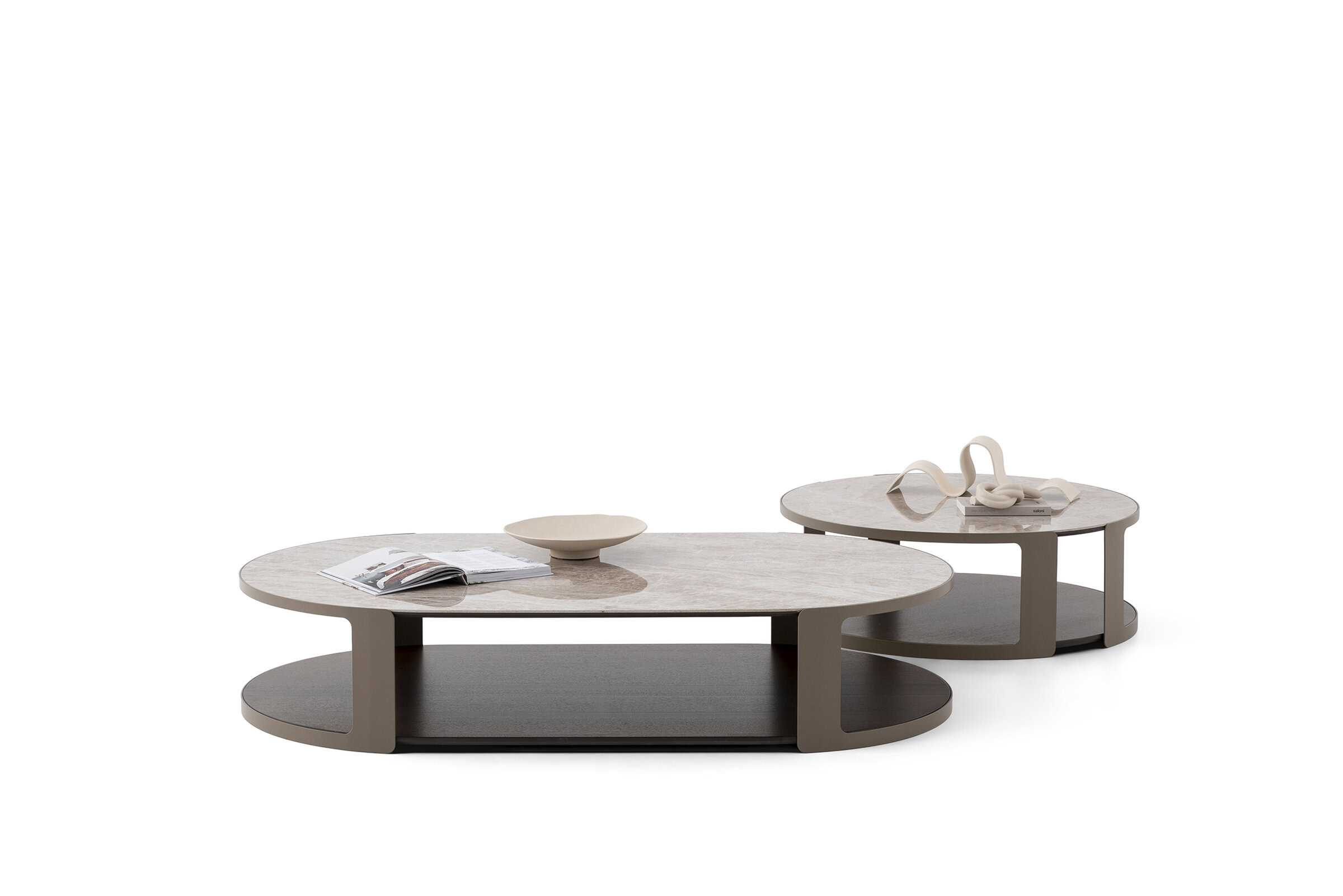 Contemporary oval and round coffee tables with sleek design and neutral tones from Saloni Furniture, perfect for modern living rooms.