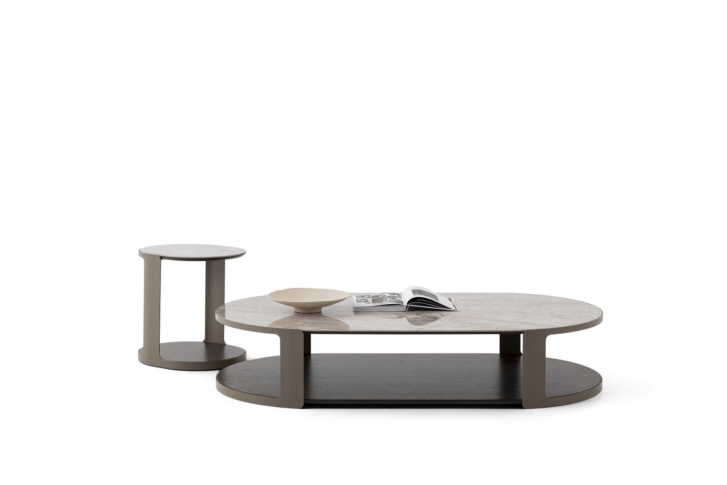 Contemporary coffee table set with a low oval table and a matching side table, featuring a minimalist design and neutral tones, perfect for modern living rooms.
