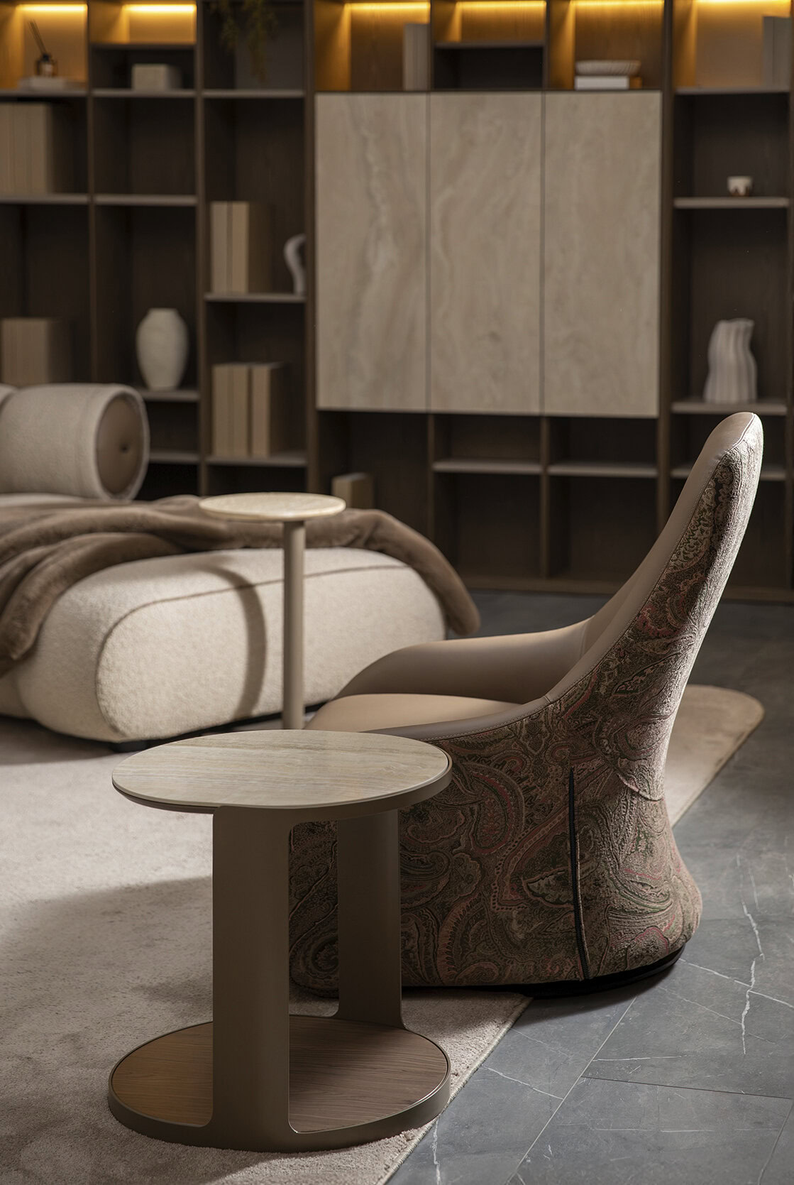 Elegant modern lounge chair with a side table in a stylish living room setting, featuring contemporary furniture and warm lighting.