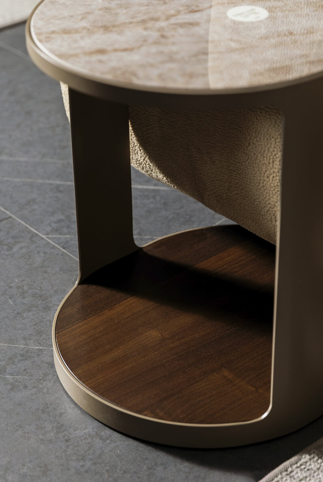 Elegant modern wooden side table with curved design and open shelf, ideal for living room decor from Saloni Furniture.