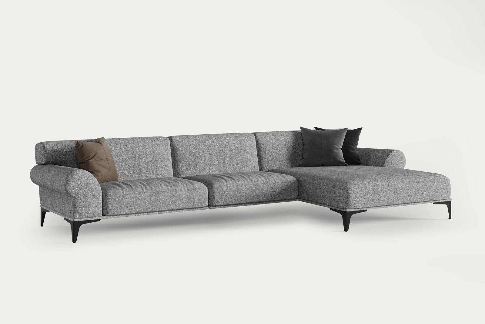 Elegant grey sectional sofa with black and brown accent pillows, perfect for contemporary living room decor.