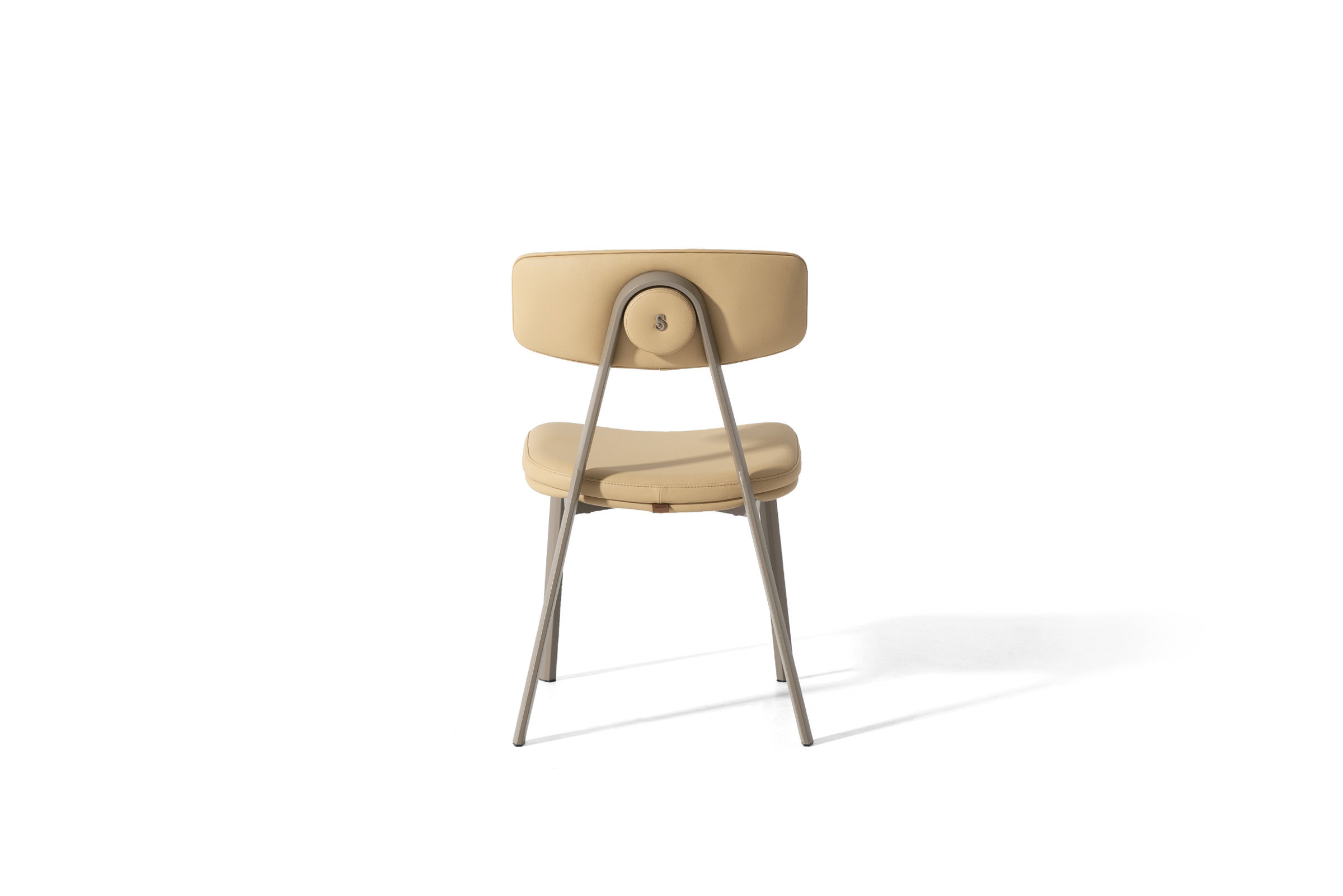 Vintage beige upholstered dining chair with sleek metal legs, perfect for modern and classic interiors, offering comfort and style for dining rooms and kitchens.
