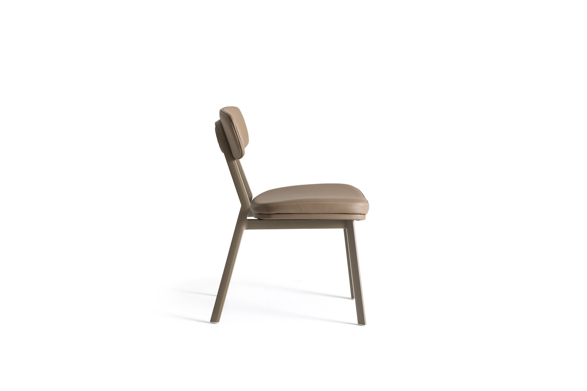 Comfortable beige upholstered dining chair with wooden legs, ideal for modern home dining rooms. Perfect blend of style and comfort, crafted by Saloni Furniture.